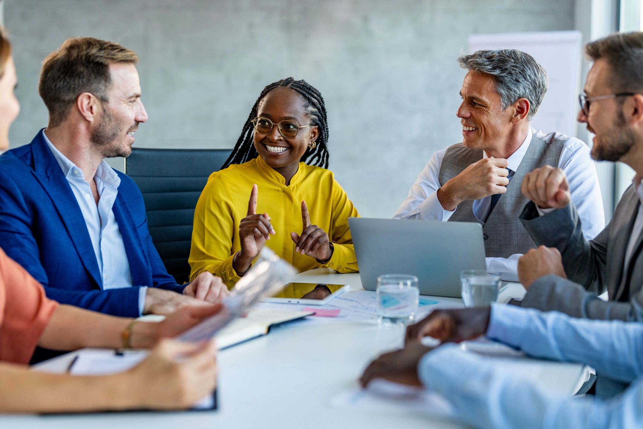 International business leaders in discussion around a conference table